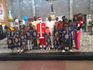 His Lordship in a group photograph with members of HCA, Good Shepherd Parish, Graceland Zaria.
